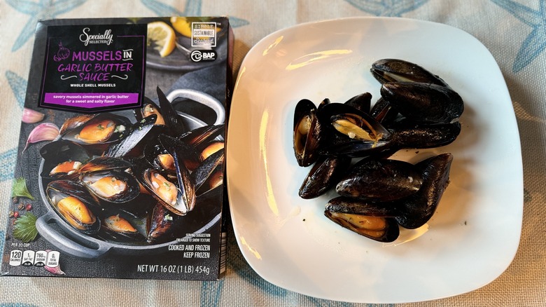 mussels on a white plate with package to the left