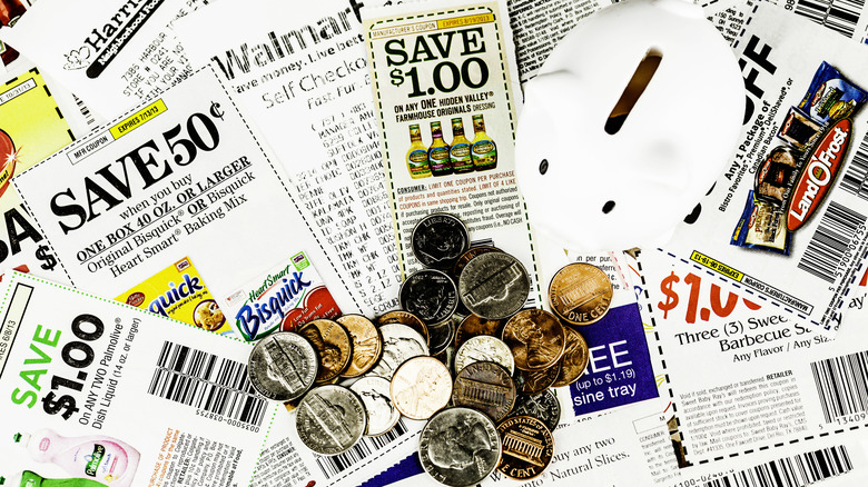 Stacks of coupons with Walmart receipt and coins