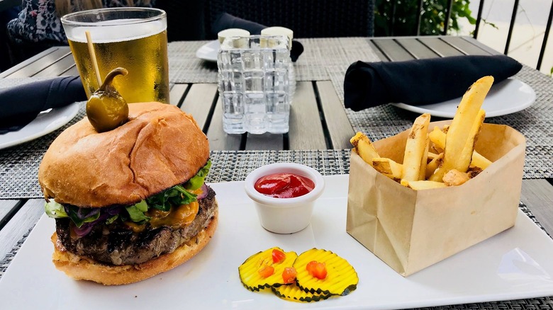 cheeseburger and french fries white plate