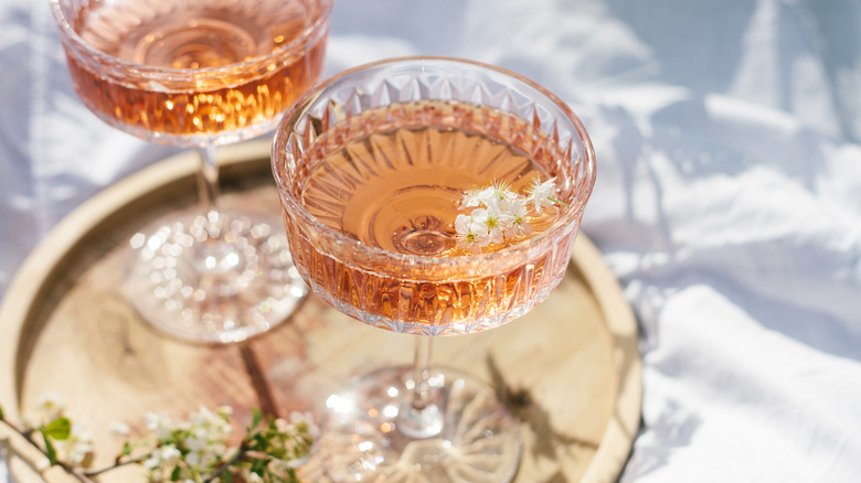 Two glasses of rosé wine on serving tray