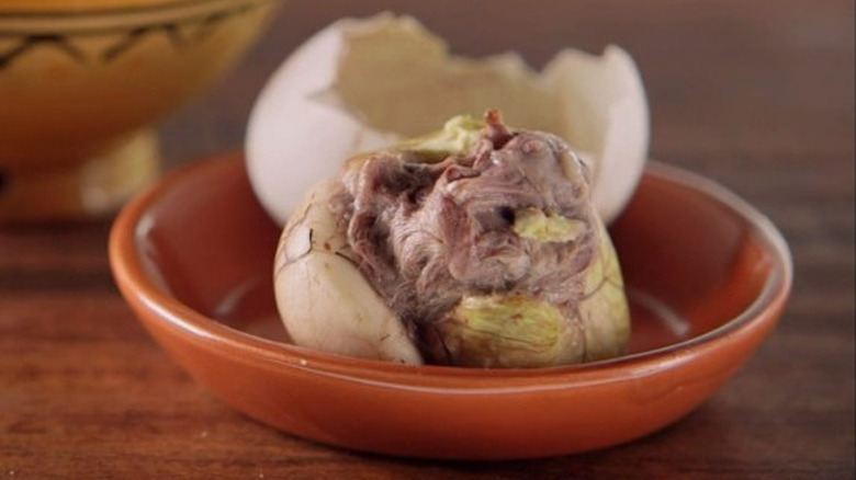 Peeled balut egg in bowl