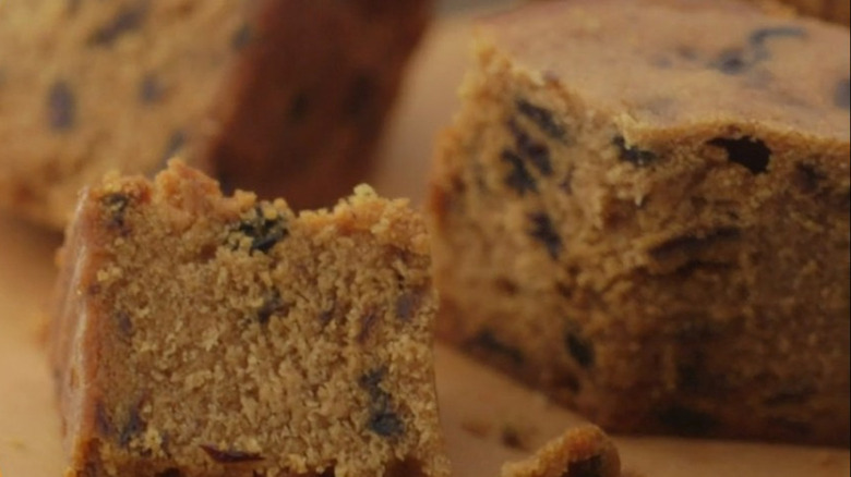 Spotted dick pudding on board