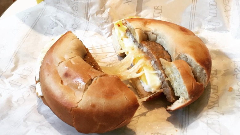 Sausage, egg, and cheese bagel on open wrapper