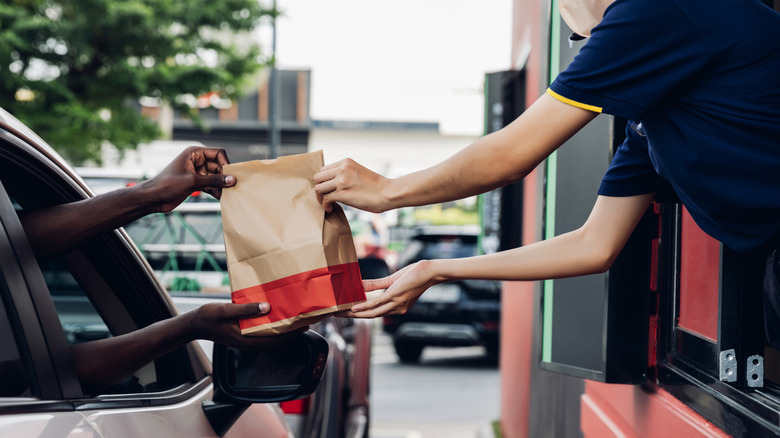 Fast food being handed off at drive-thru