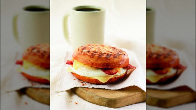 Panera Bread's Asiago Sausage & Egg Sandwich with mug of coffee