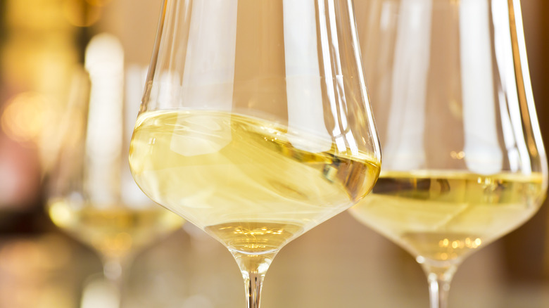 Close-up of two glasses of white wine