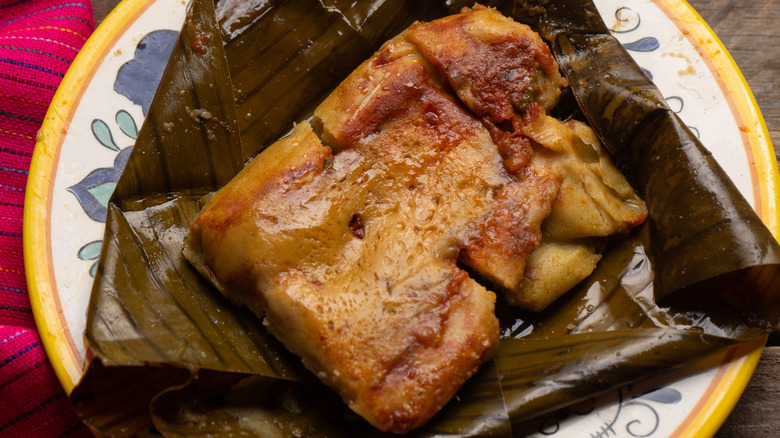 Opened tamale on banana leaf