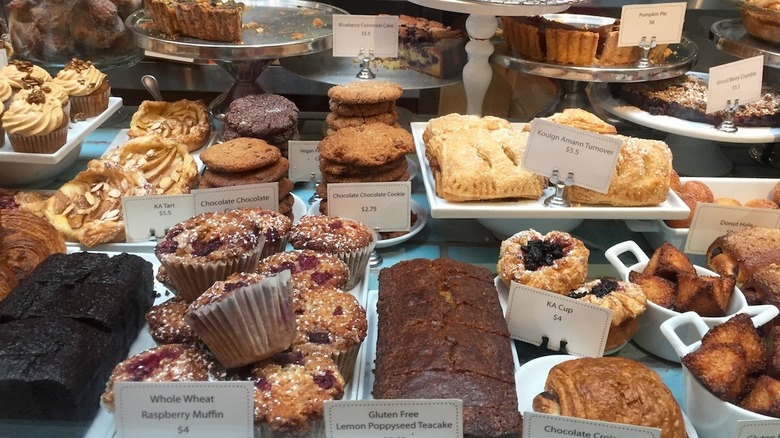 assorted pastries with name tags on display