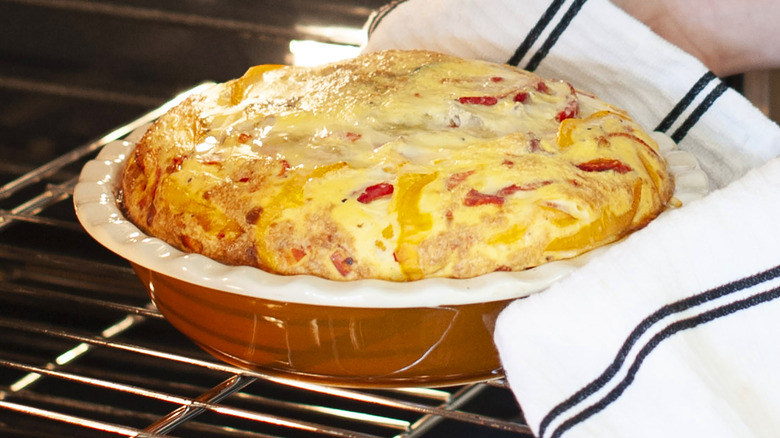 taking egg bake out of oven