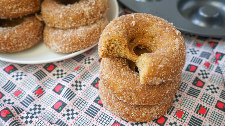 Apple cider donuts on tablecloth