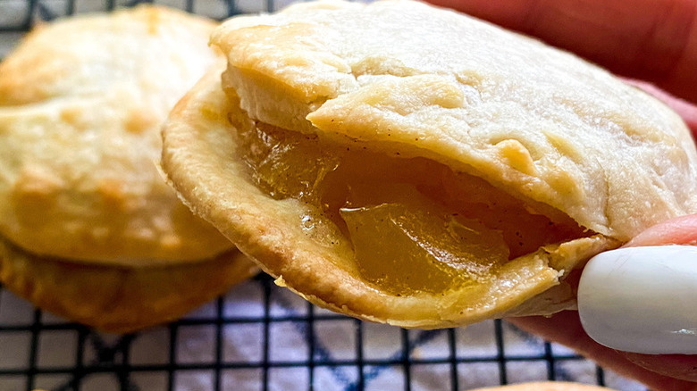 Hand holding mini apple turnover