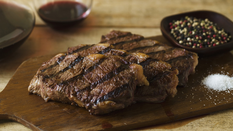 Cooked steaks on table 