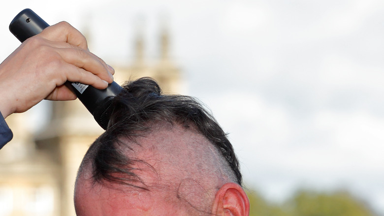 Head being shaved