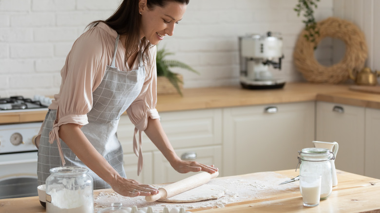 Baker rolls out dough