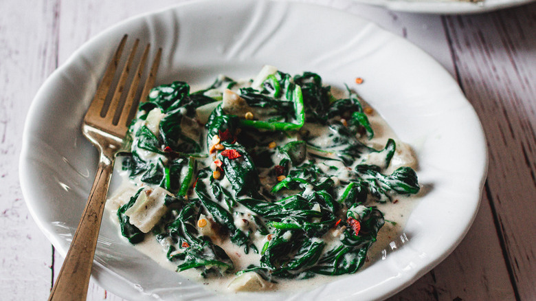 Creamed spinach on white plate