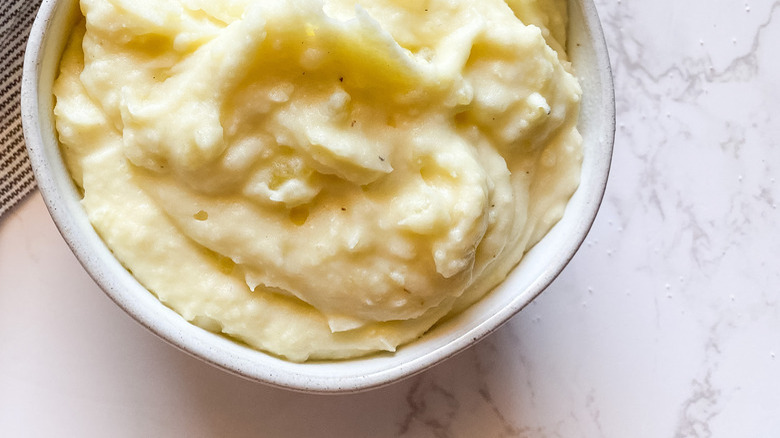 Mashed potatoes in white bowl