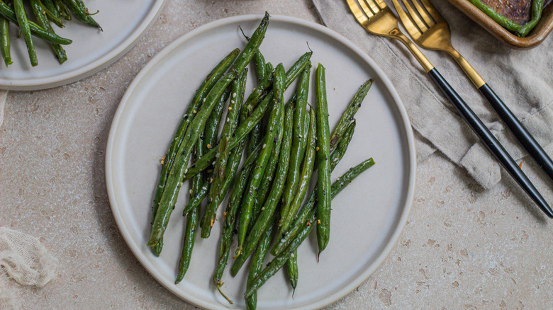 Green beans on white plate