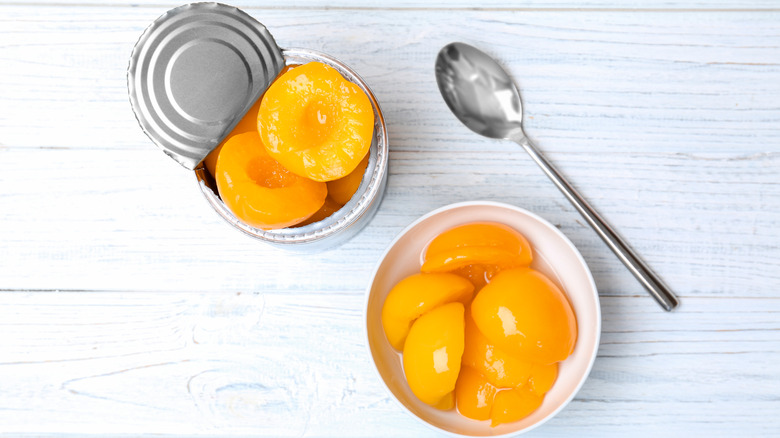 canned peaches bowl with spoon