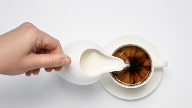 pouring coffee creamer