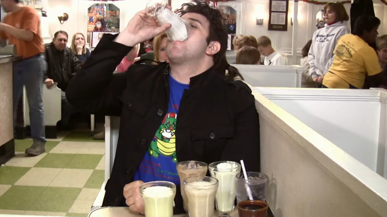 Adam Richman drinking a malt