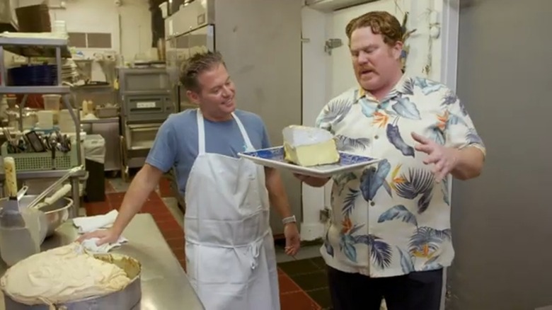 Casey Webb holding huge slice of key lime pie