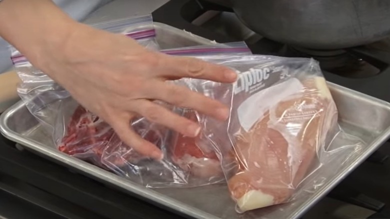 Frozen meat placed in warm water