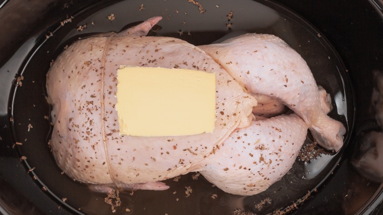 Whole chicken in slow cooker with butter