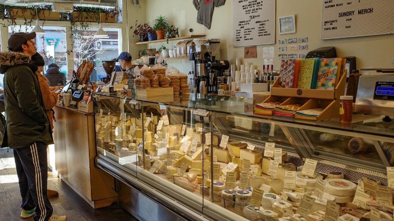 Foster Sunday man standing deli counter