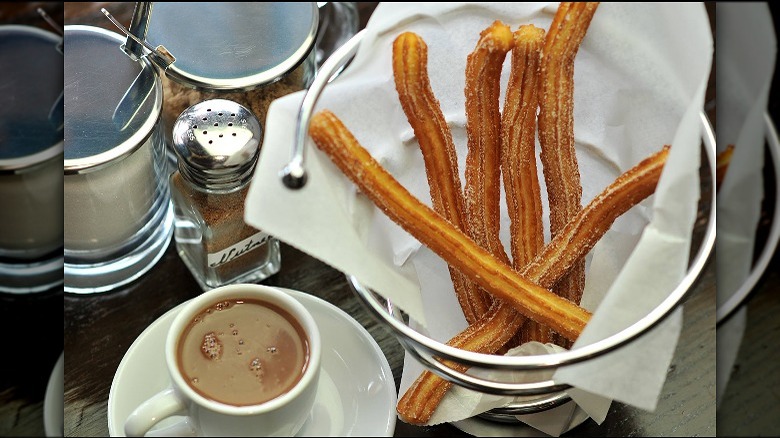 Churros in basket hot chocolate