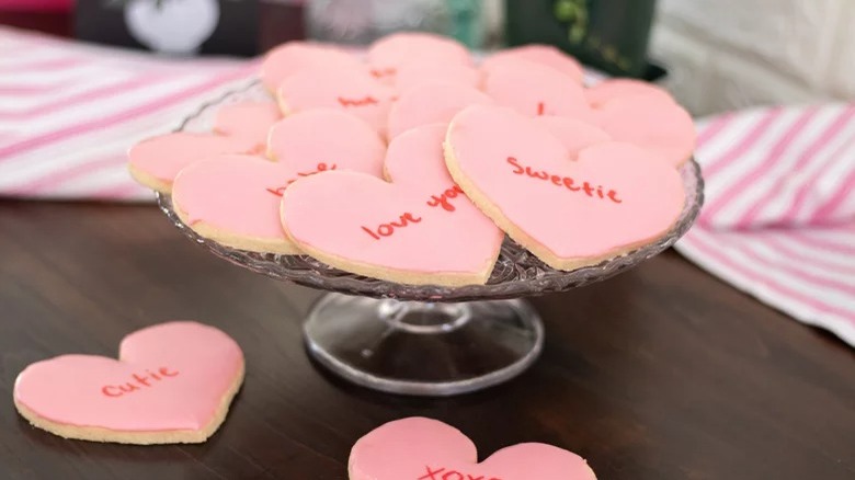 glass tray of conversation heart cookies