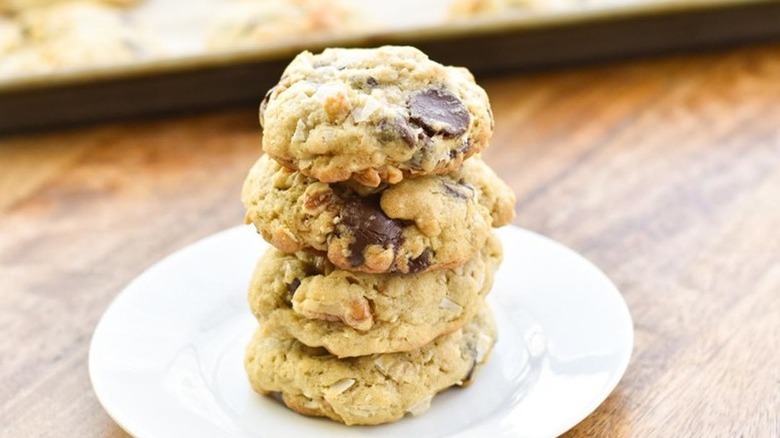 stack of four cowboy cookies on plate