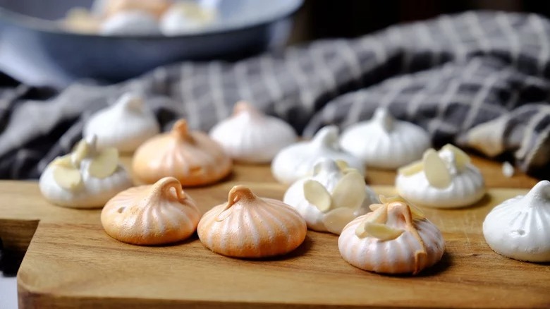 French Meringue Cookies on wooden cutting board