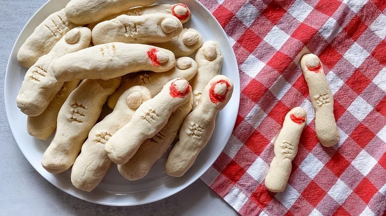 plate of witch finger cookies and red checkered napkin