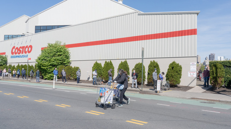 masked customers outside Costco