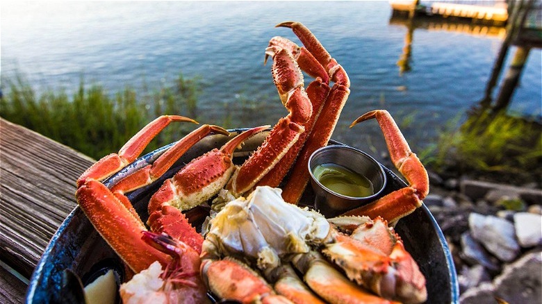 crab legs and butter in pot 