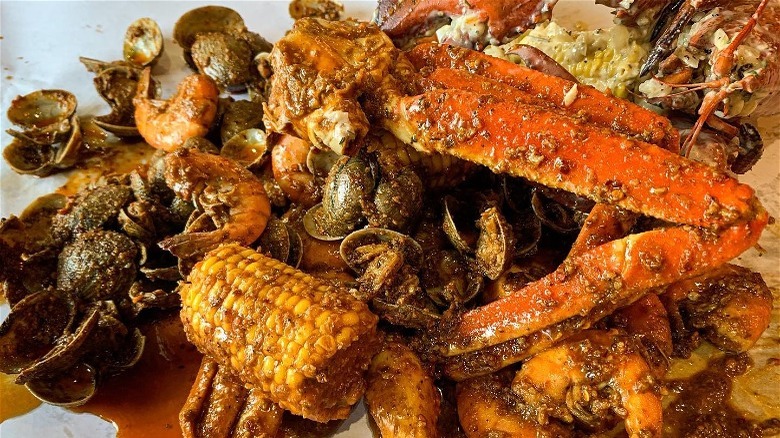seasoned crab legs, seafood, and sides