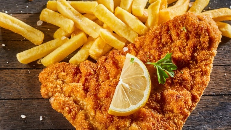 Fish and chips on a wooden board