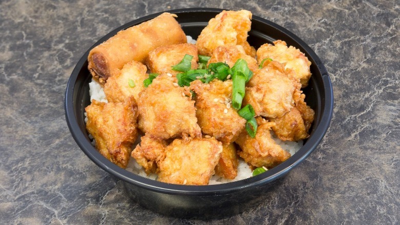 aloha chicken bowl with green onions and white rice