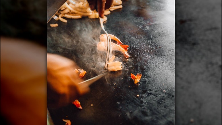 Chef cooks shrimp at Sakura