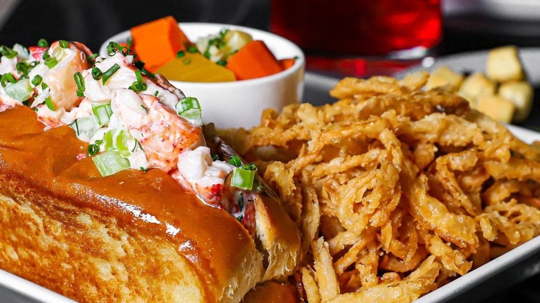 Lobster roll with fried onions and pickled vegetables