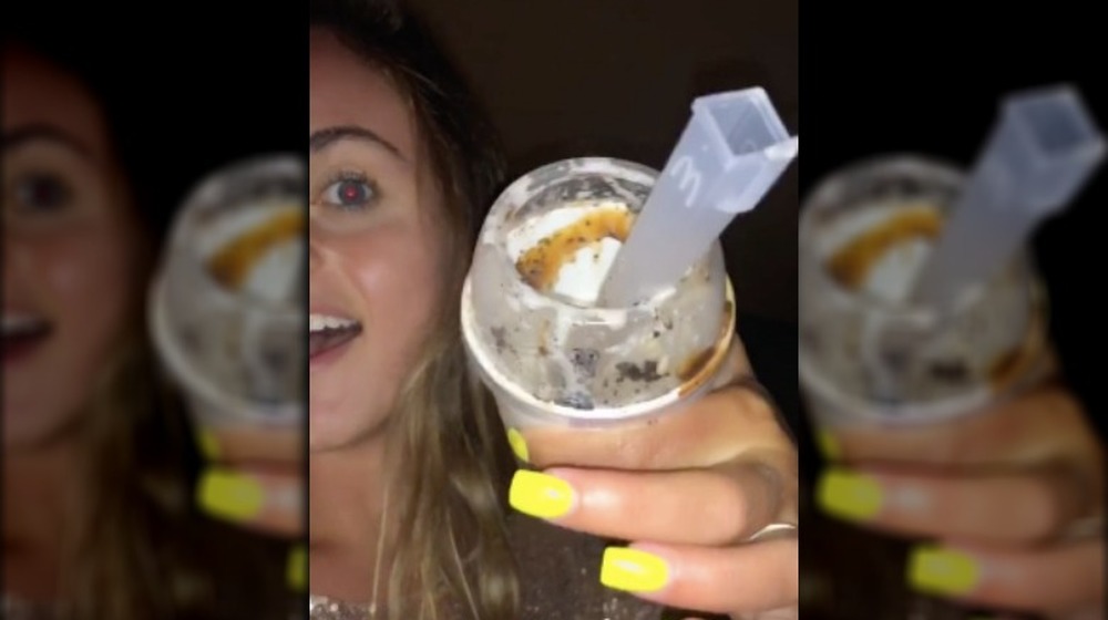 A TikTok user holding her hacked McFlurry