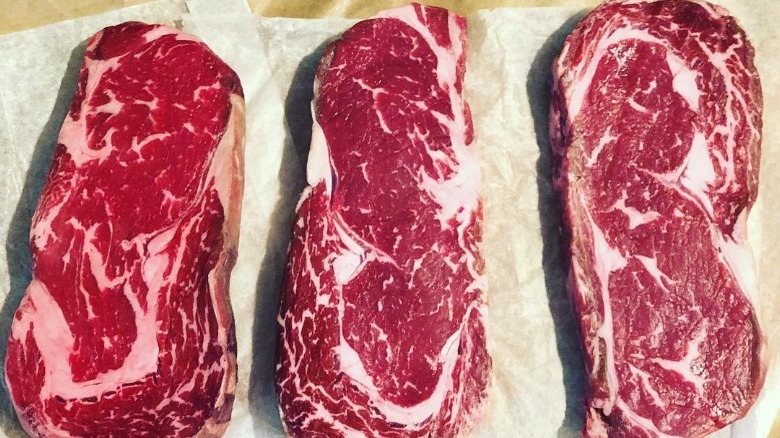 Three steaks on paper