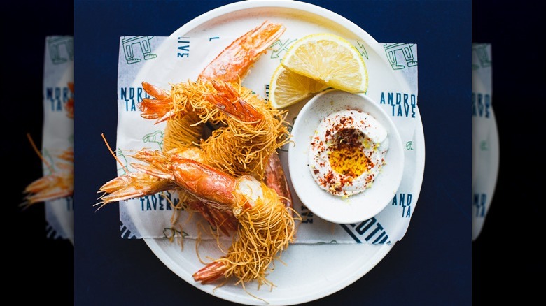 Plated shrimp saganaki with labneh 