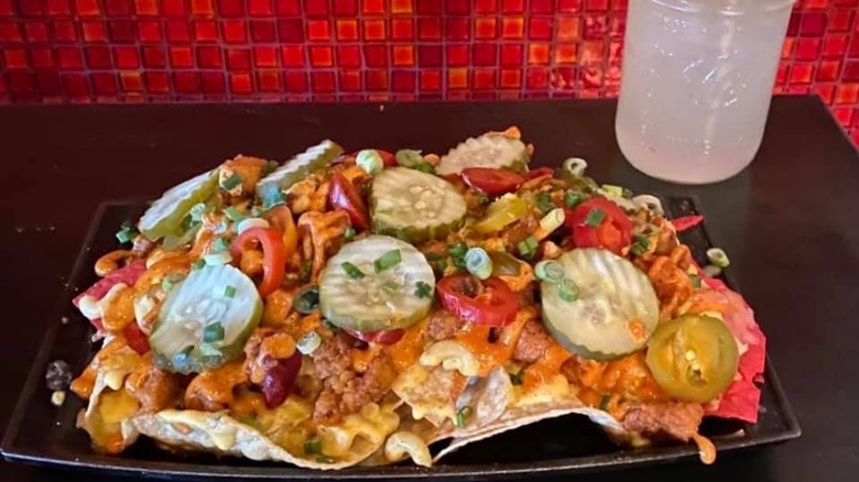 plate of nachos and drink