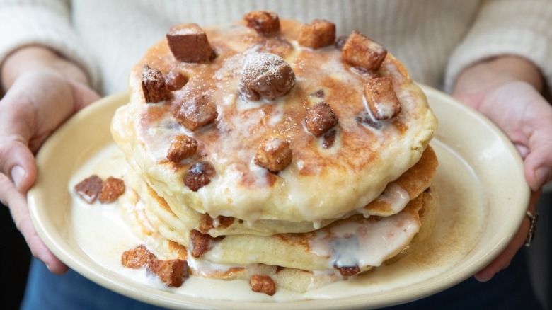 Stack of pancakes with chocolate on top