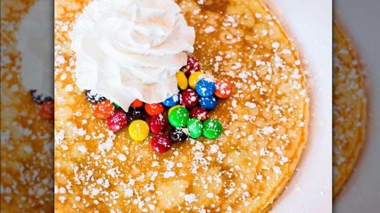 Pancake with whipped cream and candy