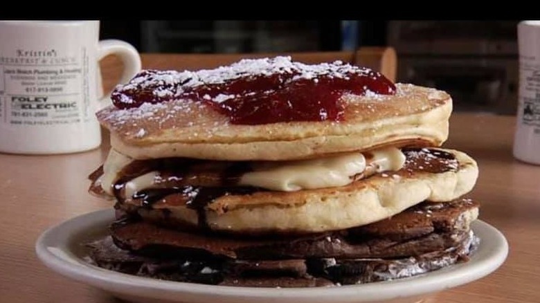Stack of pancakes with sauces 