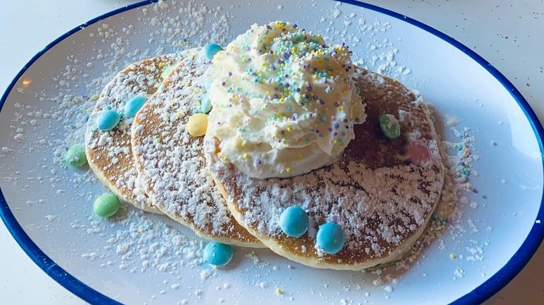 Pancakes with sprinkles/whipped cream