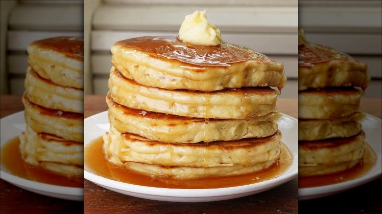 Pancakes topped with syrup and butter