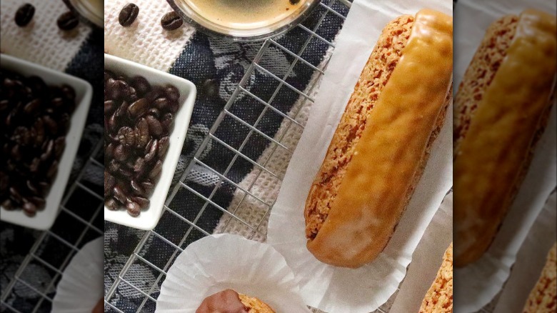 Coffee eclair with coffee and coffee beans